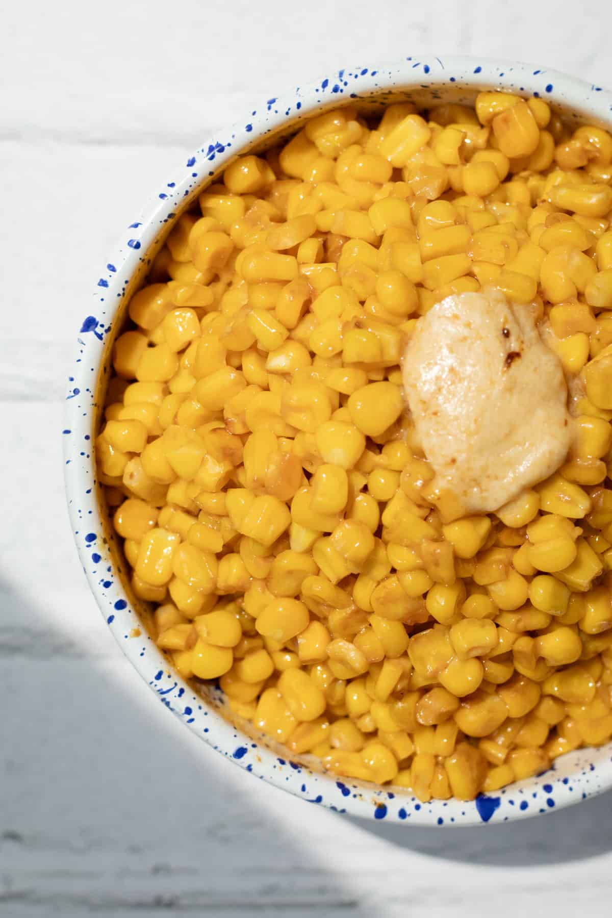 miso butter corn in a serving bowl with extra miso butter on top