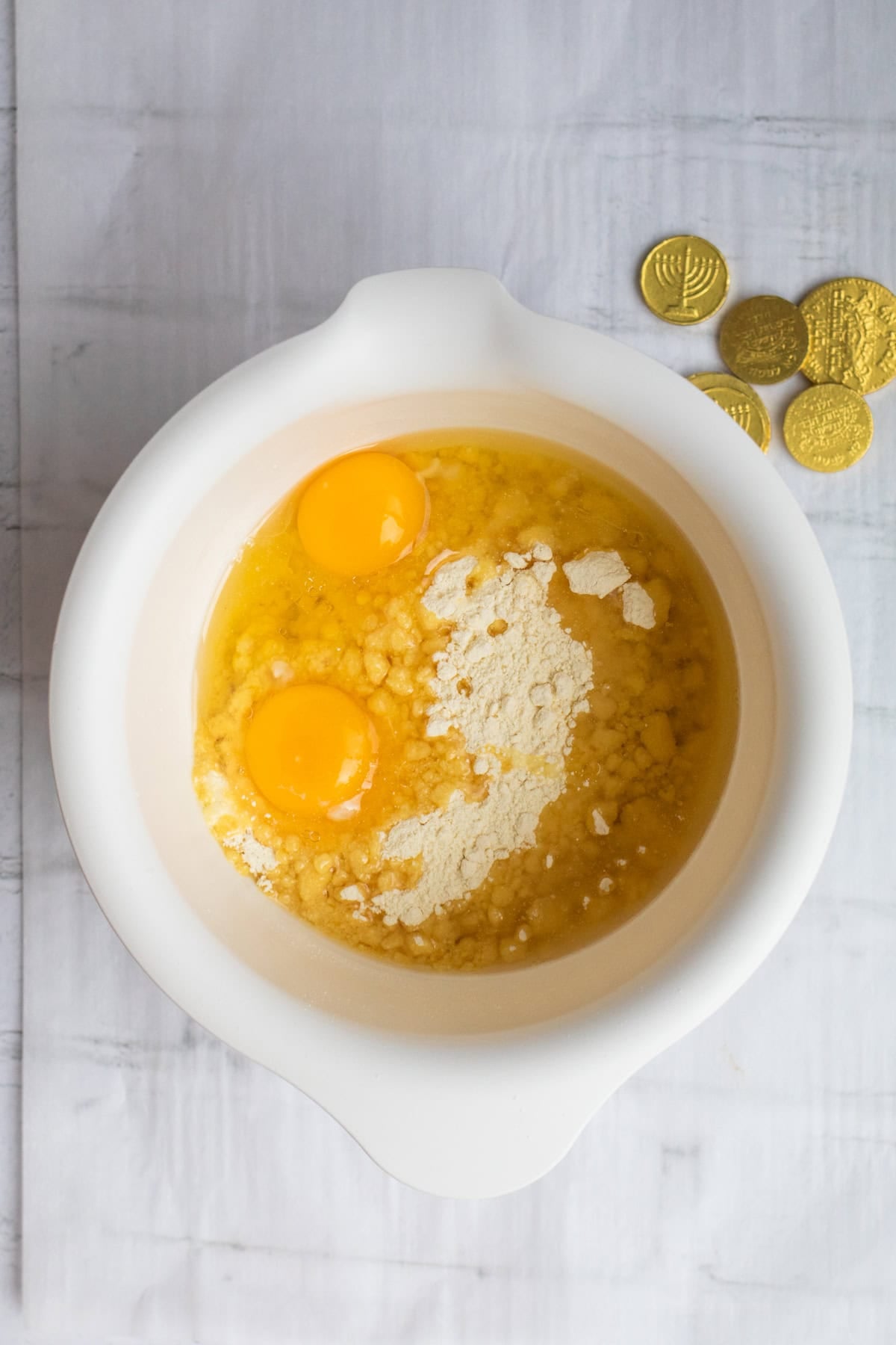 cake mix and eggs in a a mixing bowl.
