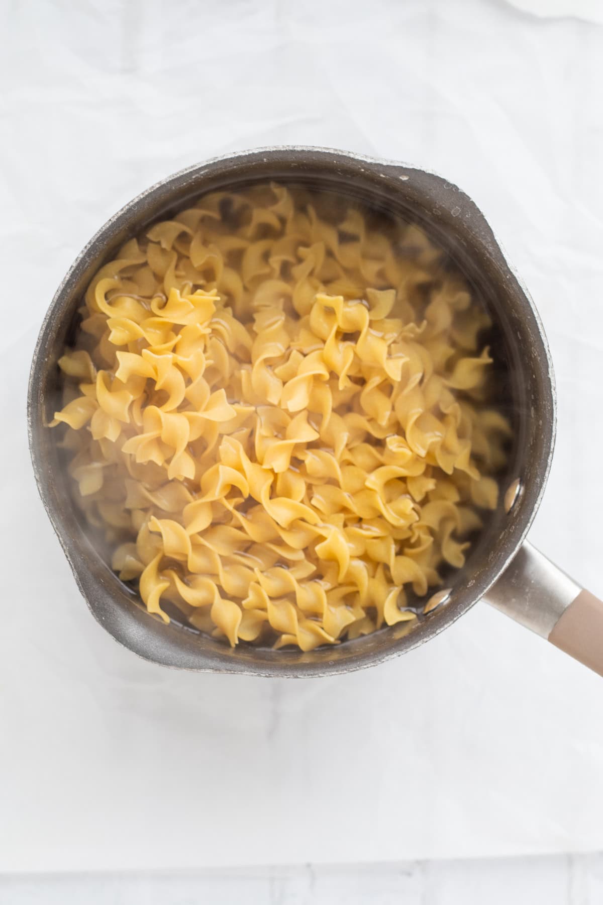 egg noodles boiling in a pot