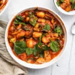 gnocchi with marinara sauce and vegetables in a serving bowl.