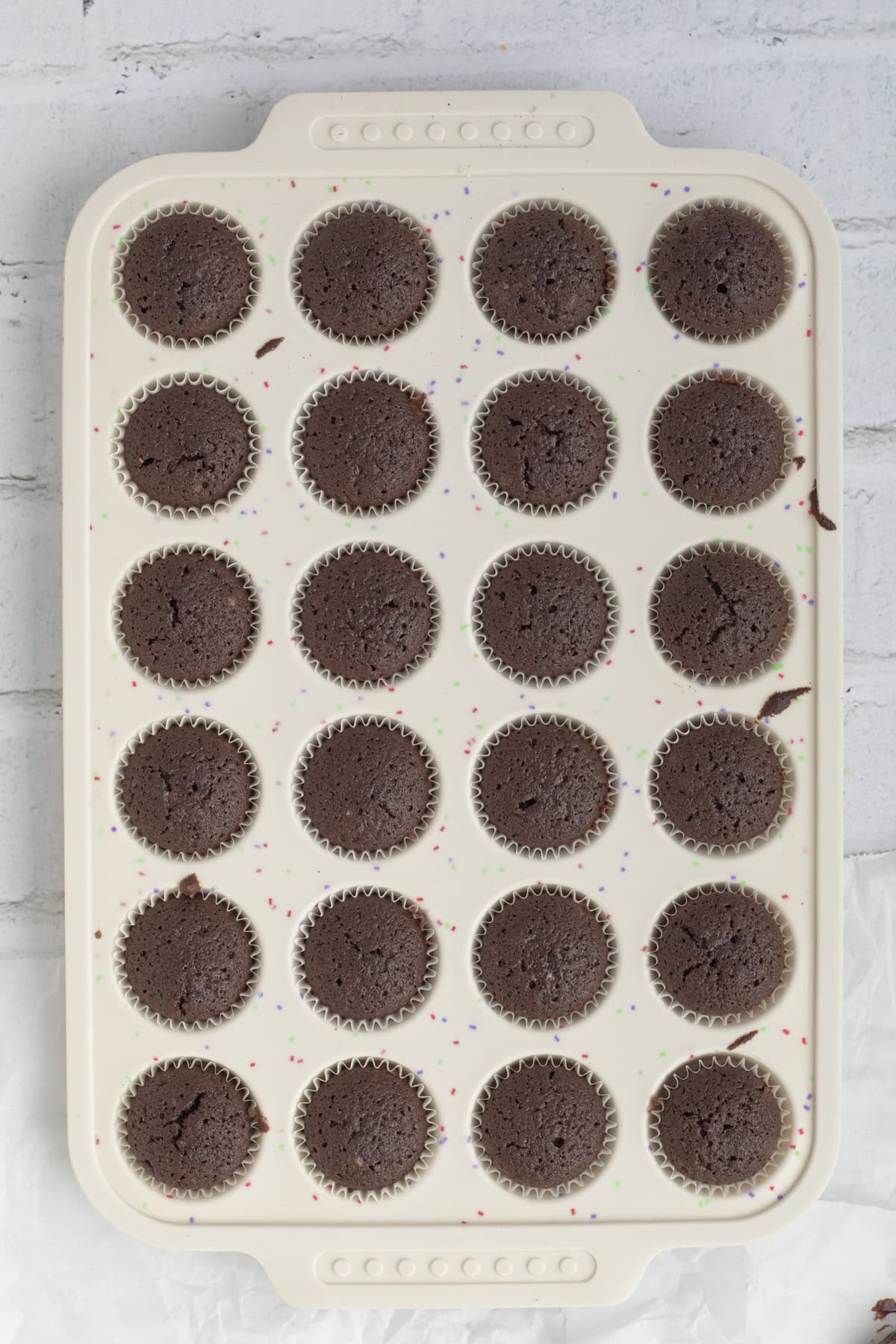 Brownie bites in a mini miffun tin just out of the oven.