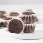 three brownies on a small white plate.