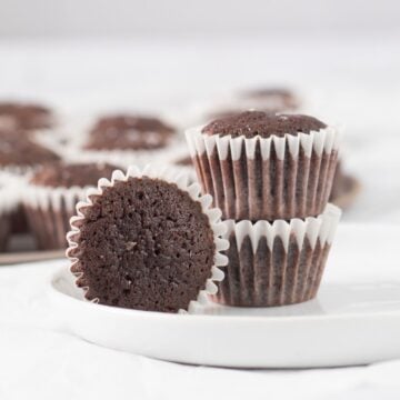three brownies on a small white plate.