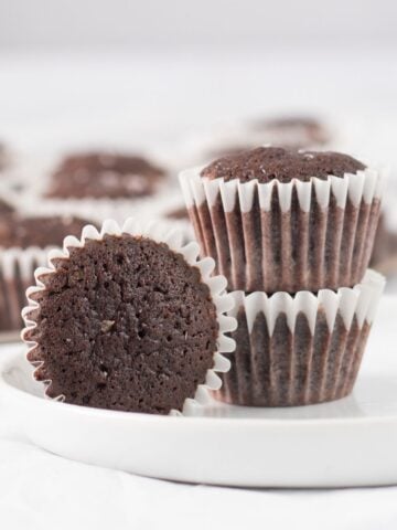 three brownies on a small white plate.
