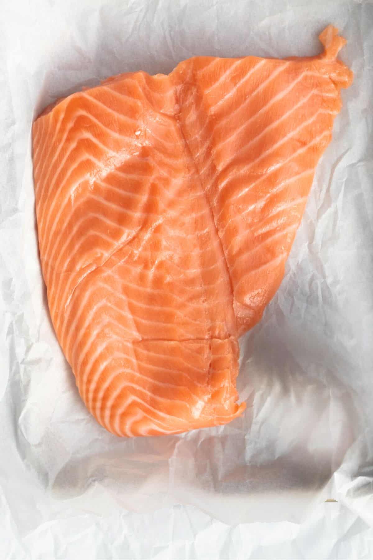 salmon patted dry on parchment paper.