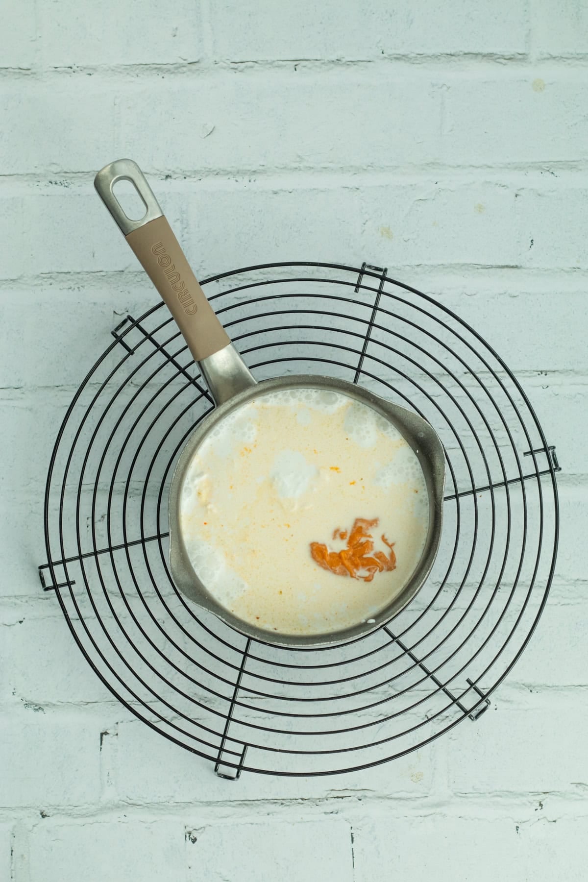 coconut milk and curry sauce in a saucepan.