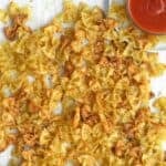 baked pasta chips with marinara sauce.