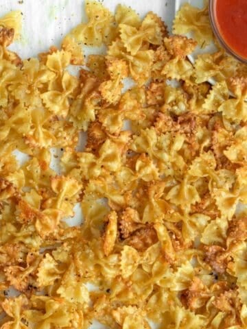 baked pasta chips with marinara sauce.