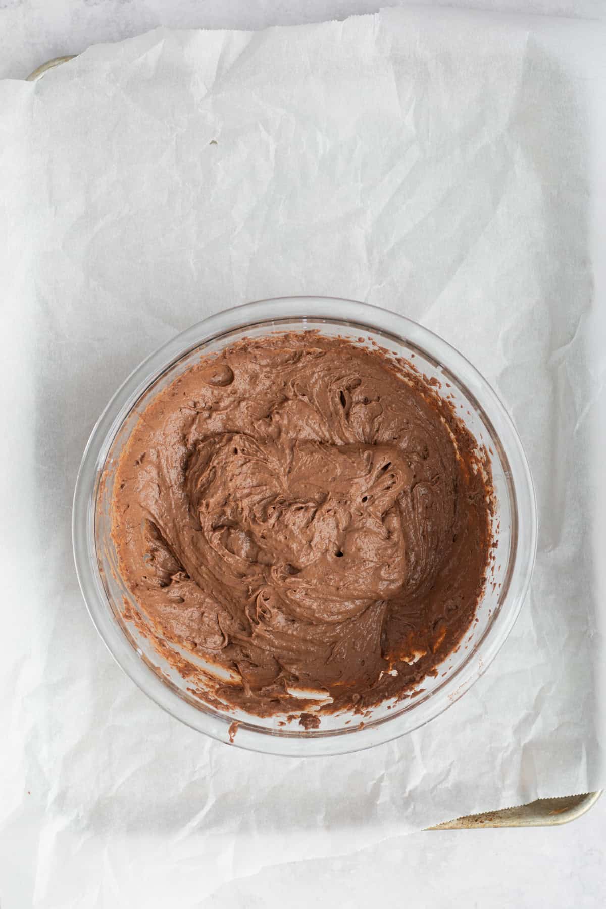 chocolate pudding mixed in a glass bowl.