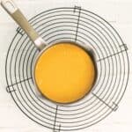 thai red curry sauce in a pot on a cooling rack